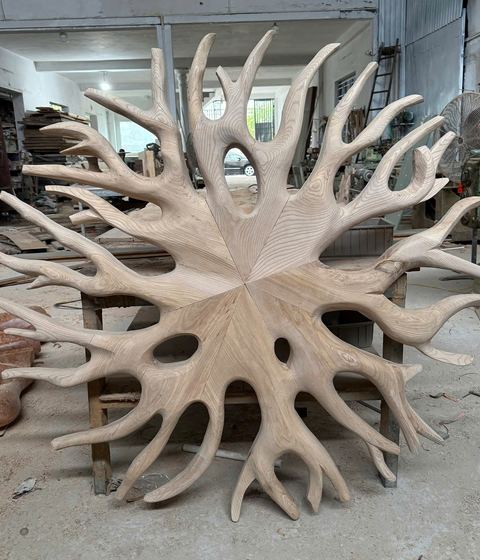 Radiating driftwood wall art in raw wood