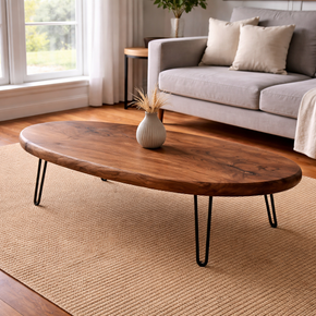 Traditional oval coffee table in solid wood with smooth surface and classic design