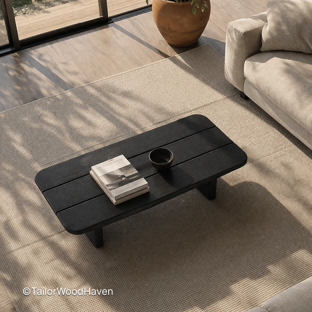 Minimal black wood coffee table with structured form and balanced proportions