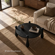 Modern black round coffee table with clean edges and balanced shape