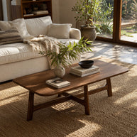 Brown solid wood coffee table with clean edges and warm finish