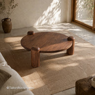 Round walnut coffee table with solid wood construction and natural grain