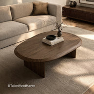 Minimal oval wooden coffee table with smooth surface and balanced proportions