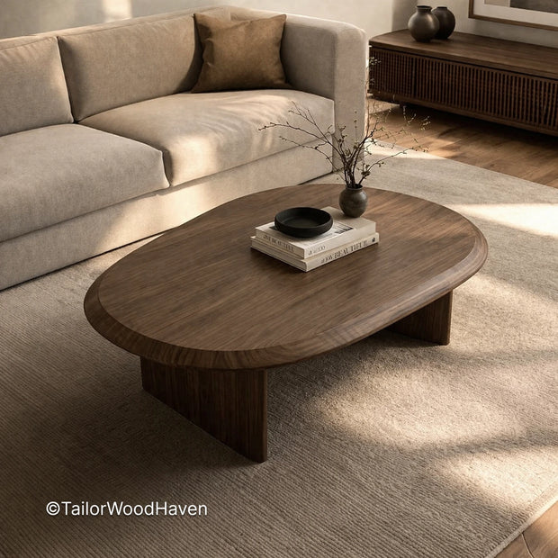 Minimal oval wooden coffee table with smooth surface and balanced proportions