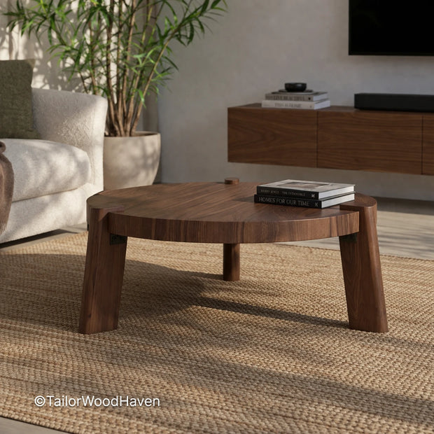 Minimal round solid wood coffee table with smooth surface and balanced proportions