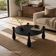 Solid wood round coffee table with black finish and minimalist design