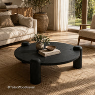 Solid wood round coffee table with dark tone and balanced shape