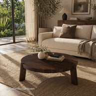 Round coffee table in dark wood finish with simple and grounded style