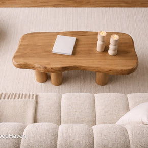 Small oval coffee table in solid wood with compact design and smooth surface
