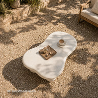 White outdoor coffee table made of solid wood with a smooth surface and clean design
