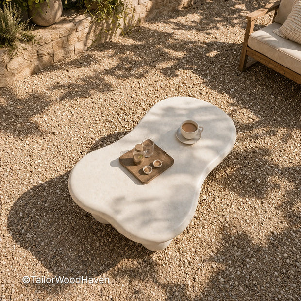 White outdoor coffee table made of solid wood with a smooth surface and clean design