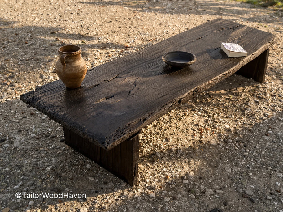 Black outdoor coffee table made of solid wood with a smooth surface and modern design