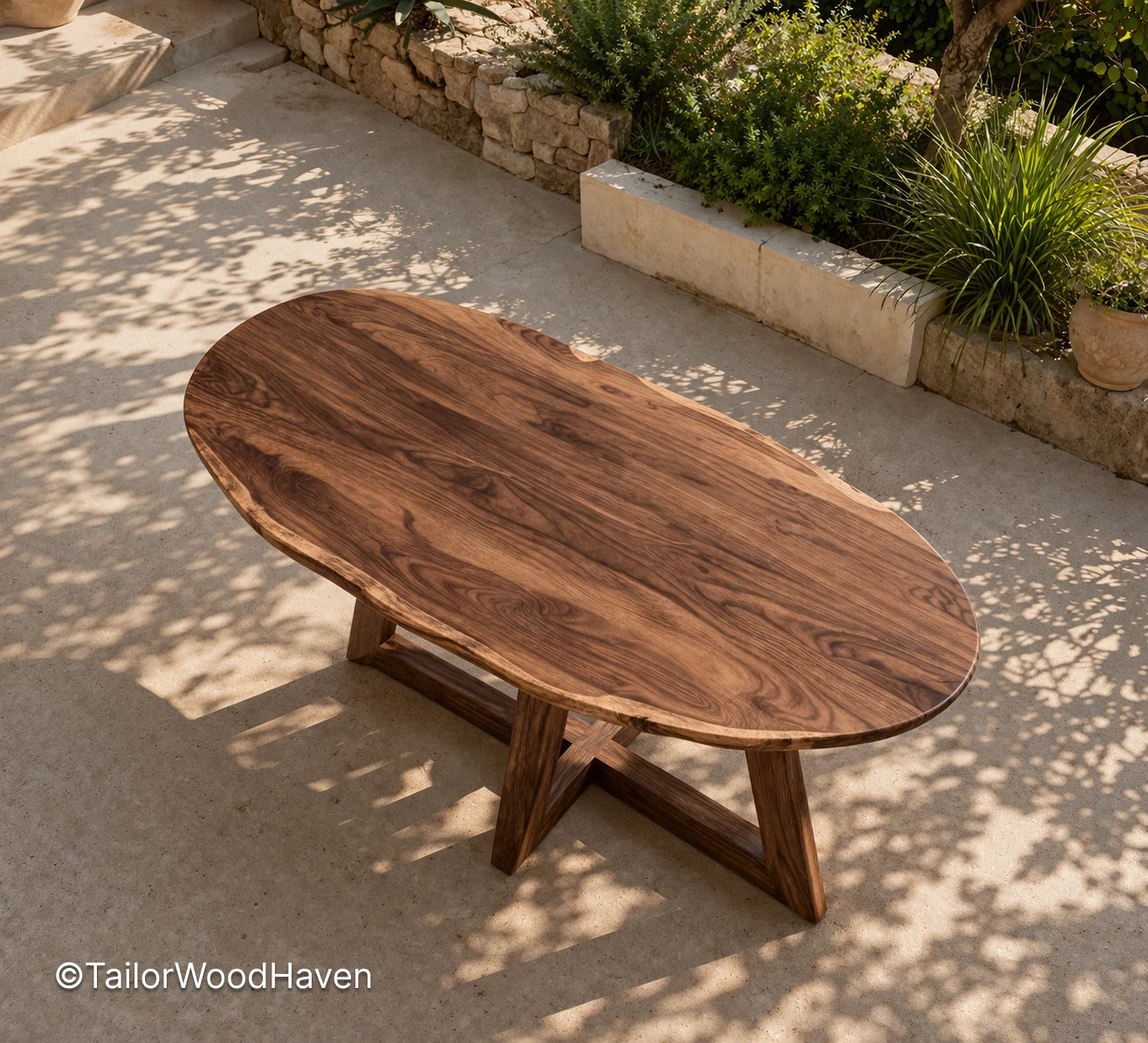 Oval outdoor coffee table made of solid wood with a smooth surface and balanced design