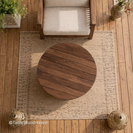 Circular patio coffee table with durable wood construction and clean edges