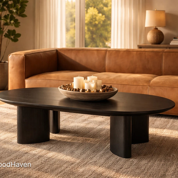 Black oval coffee table in solid wood with smooth surface and modern design