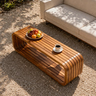 Contemporary patio coffee table with clean edges and durable wood construction