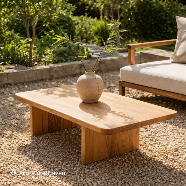 Rectangular outdoor coffee table made of solid wood with a smooth surface and clean design