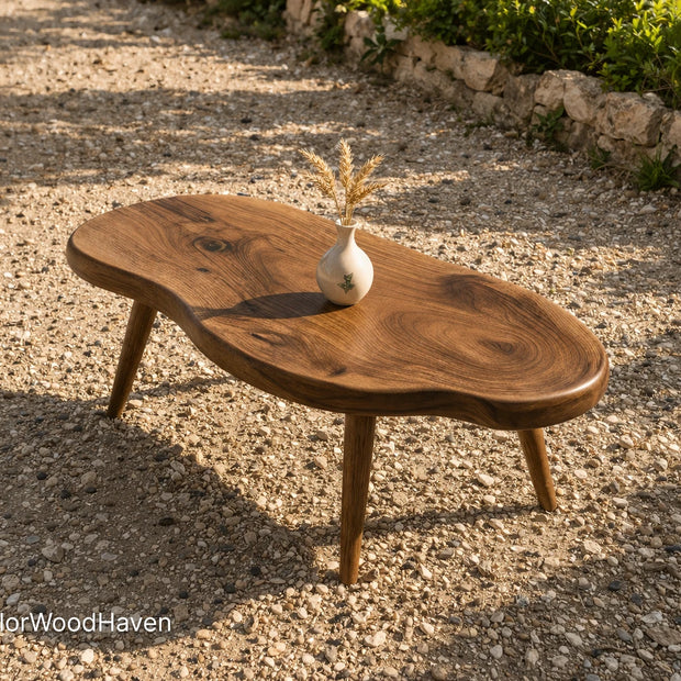 Oval coffee table for outdoor seating areas with durable build and soft curved shape