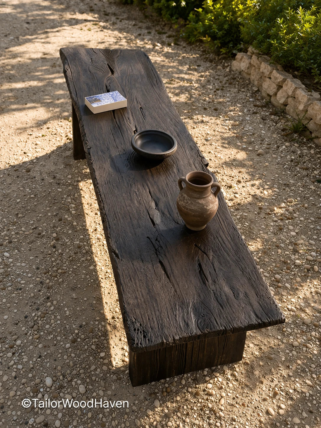 Solid wood outdoor coffee table with black finish and clean structured shape