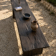 Solid wood outdoor coffee table with black finish and clean structured shape