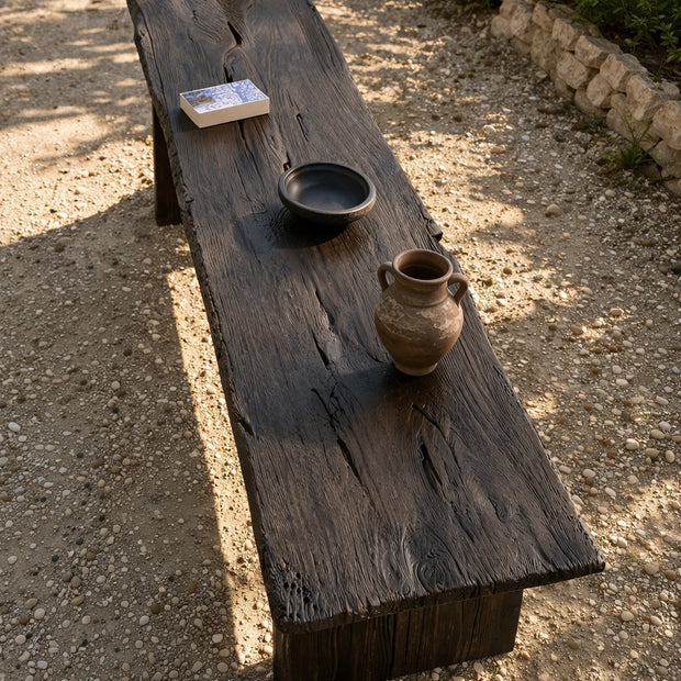 Solid wood outdoor coffee table with black finish and clean structured shape