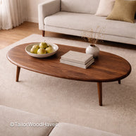 Contemporary oval coffee table in walnut wood with smooth surface and modern design