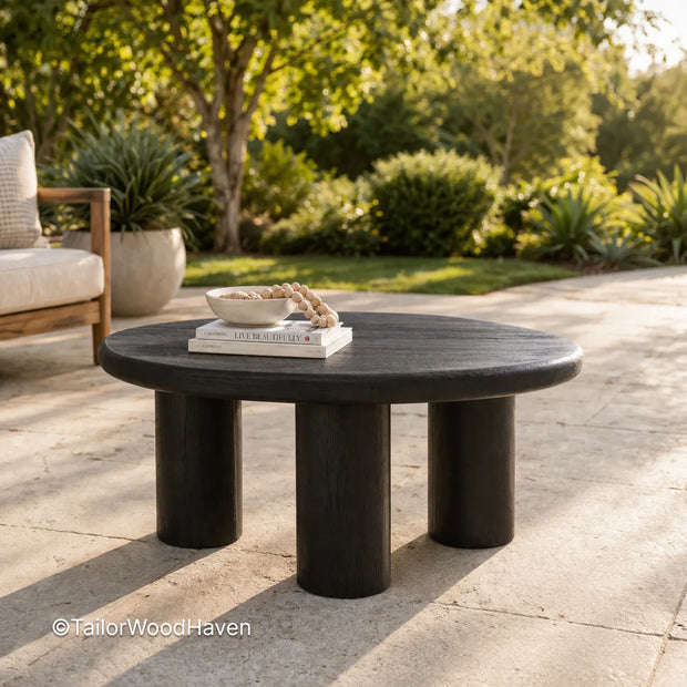 Solid wood round patio coffee table with black finish and clean edges