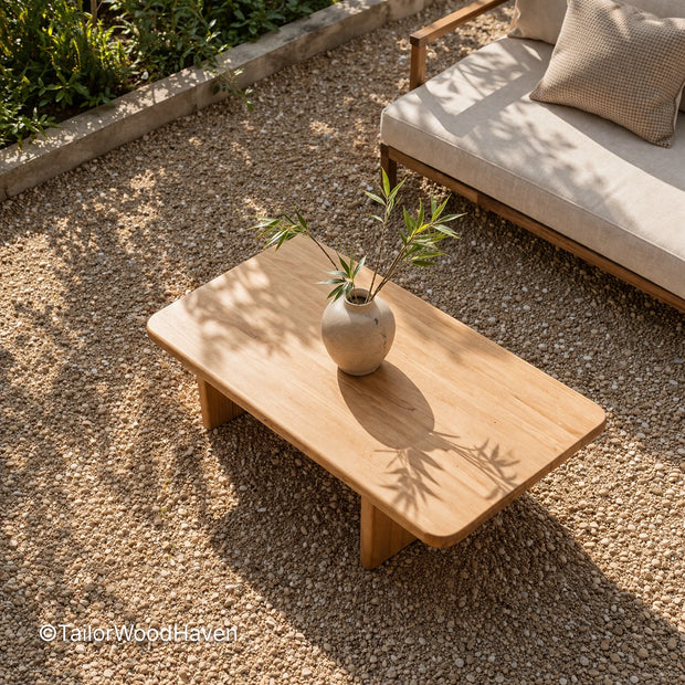 Solid wood rectangular patio coffee table with durable construction and extended tabletop