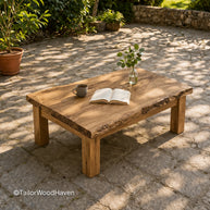 Large square outdoor coffee table made of solid wood with a wide smooth surface