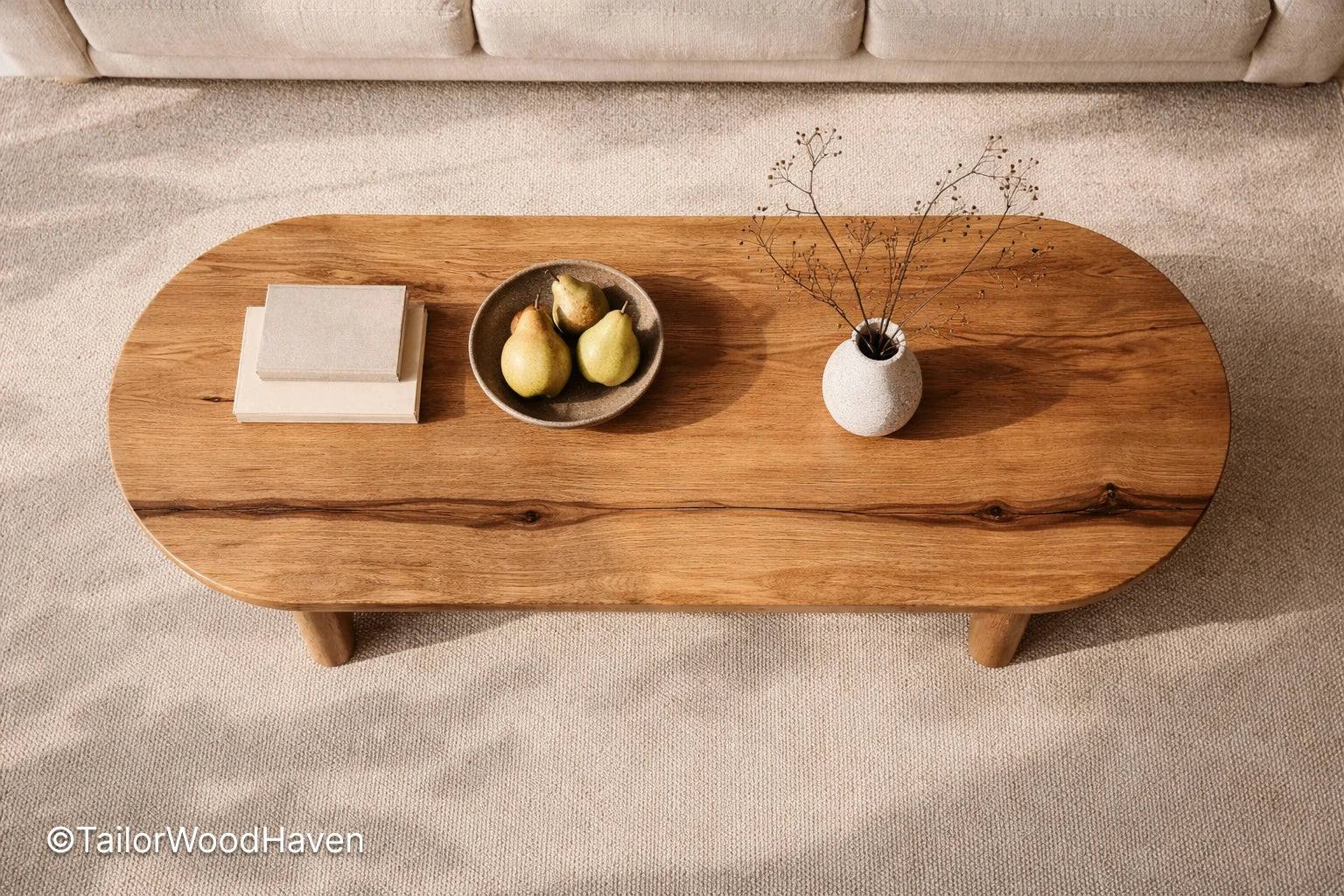 Solid wood oval coffee table with minimalist design and balanced proportions