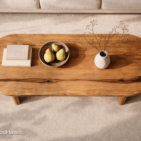 Solid wood oval coffee table with minimalist design and balanced proportions