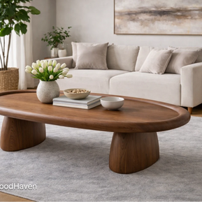 Wide oval coffee table for living room with natural wood grain and balanced shape