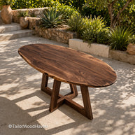 Oval coffee table for outdoor spaces with curved shape and stable structure