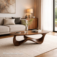 Walnut oval coffee table in solid wood with rich grain and smooth surface