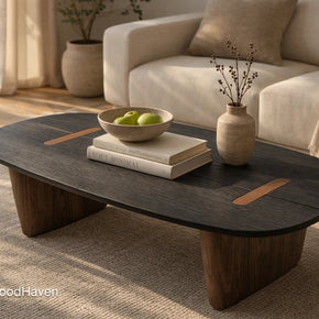 Dark wood oval coffee table with minimalist shape and rich wood tone