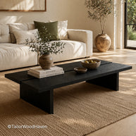 Modern black coffee table with rectangular top and sturdy construction