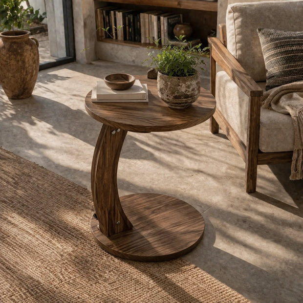 Small round solid wood coffee table with natural grain and compact design