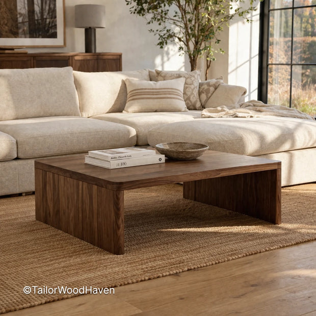Square solid wood coffee table with clean edges and natural grain detail