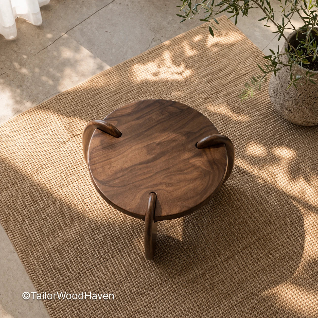 Small round solid wood coffee table with compact design and natural grain detail