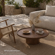 Modern round coffee table with solid wood construction and natural grain
