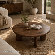 Round coffee table in living room with solid wood construction and natural grain