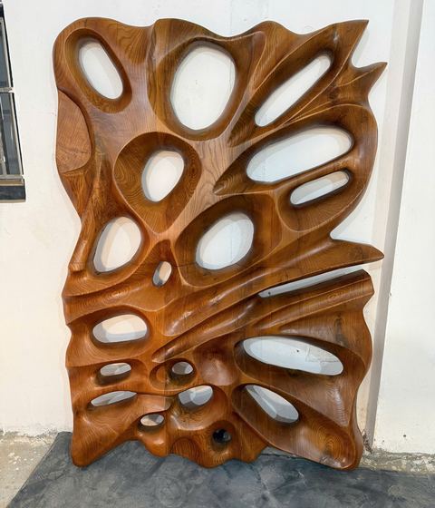 Carved wall art in ash, finished, on the wall