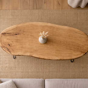 Solid wood traditional oval coffee table with clean edges and timeless style