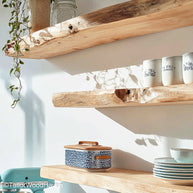 Rustic kitchen floating shelves made from aged wood with sealed finish and bracket free design, ideal for spices, dishes, or warm kitchen decor