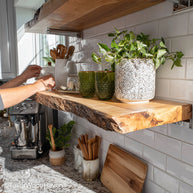 Rustic floating wood shelves crafted from vintage-inspired timber with natural wear and wall-mounted design, suited for farmhouse or cabin interiors