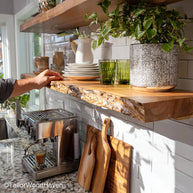 Live edge wood shelves designed with thick wood grain and freeform edge, wall-mounted to offer natural storage solutions in any living space