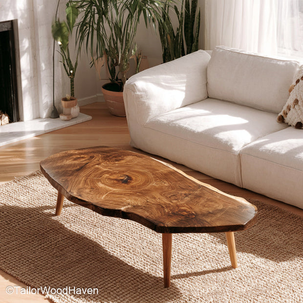 Small wood slab coffee table made from real timber with a sealed live edge and compact form, ideal for cozy living rooms or small seating areas