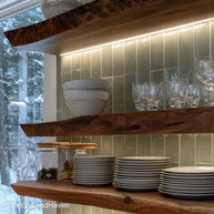 Live edge kitchen shelves crafted from sealed hardwood with natural edges and floating design, made for both open storage and visual interest