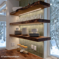Wooden rustic floating shelves designed from reclaimed wood with a worn finish and wall mounted frame, perfect for cozy kitchens or boho rooms