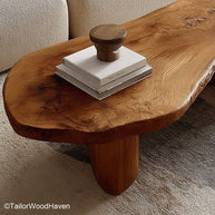 Rustic slab coffee table crafted from weathered wood with natural edges and bold surface, ideal for living rooms with earthy, vintage charm